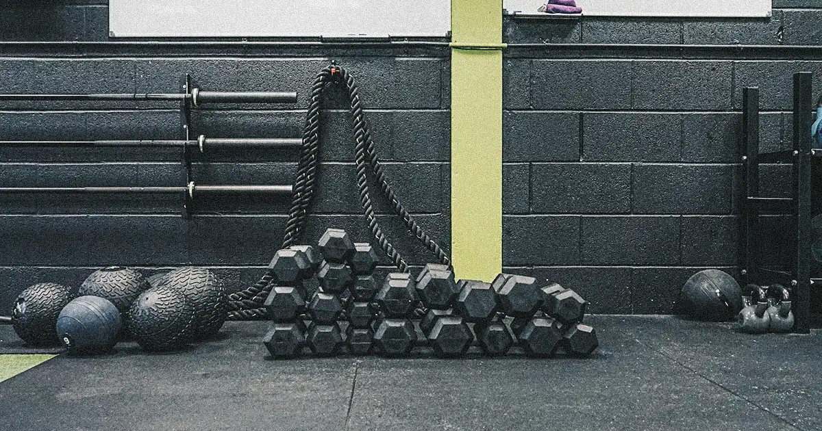 dumbbells and medicine balls on training ground