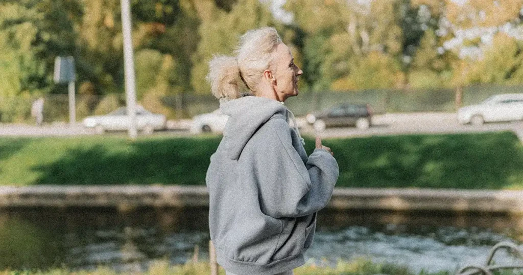 An old lady brisk walking in the park