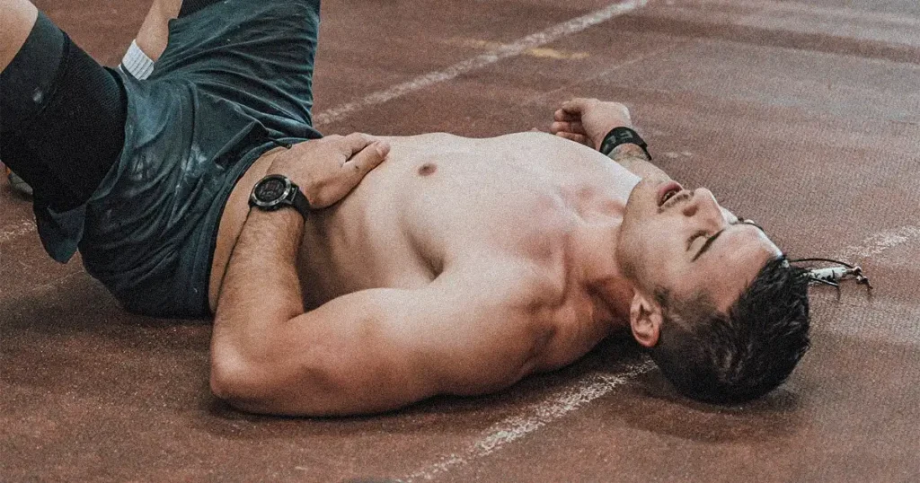 Exhausted man lying on the ground