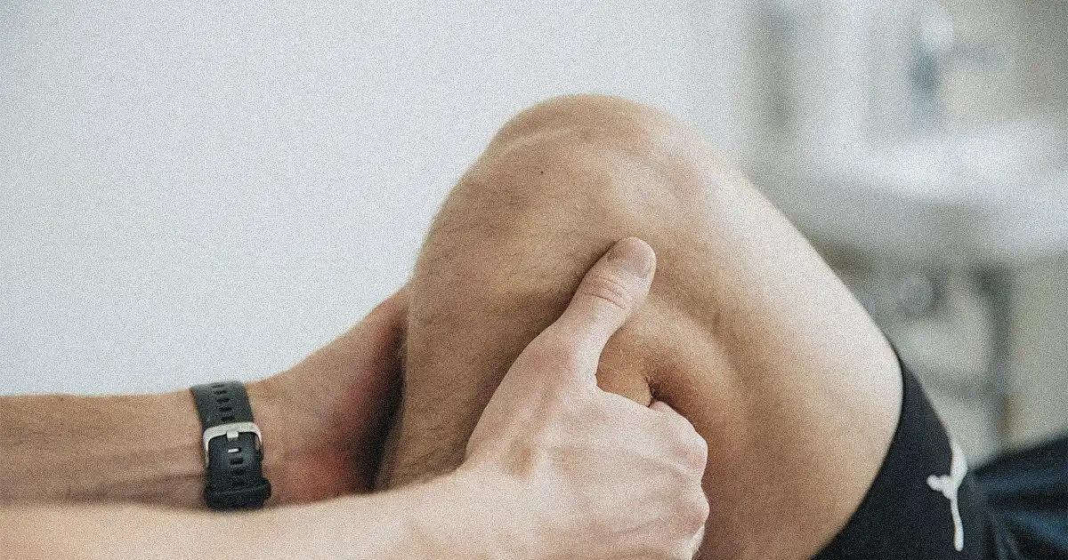 A man doing knee assessment