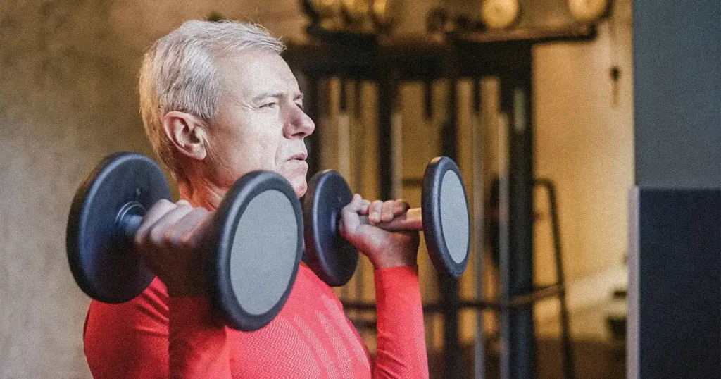 A old man lifting dumbbells