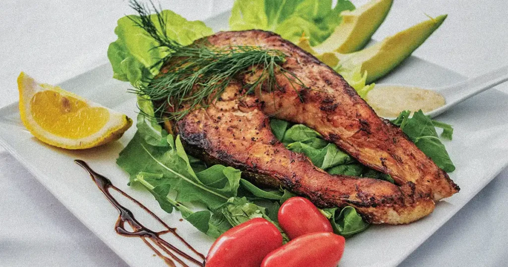 A plate with salmon and vegetable 