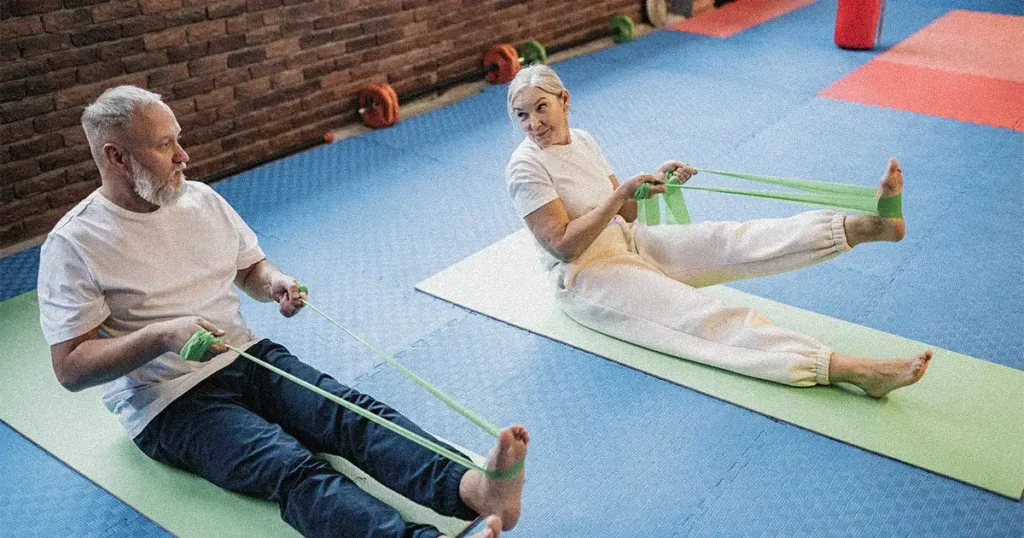 seniors doing stretches with resistance bands